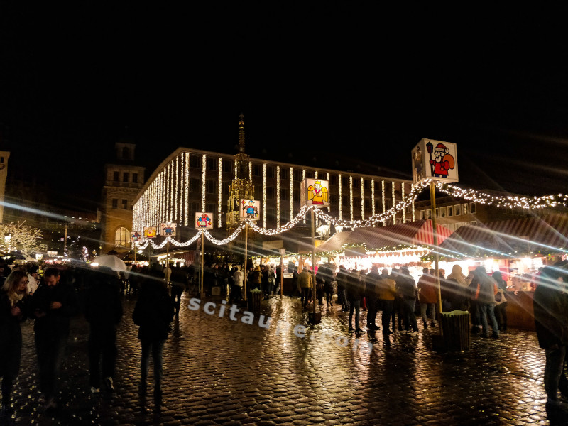 Nuremberg Christmas Market - Rain or Snow never stop the show. People enjoy themselves more and more. A lane with the market hopping crowd