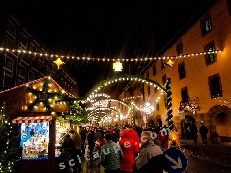 Christkindlesmarkt: A magnificently lit lane, full of  Christmas booths and bustling with market hoppers.