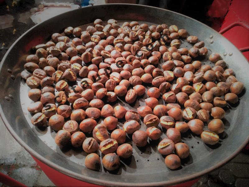 Christkindlesmarkt:  Iron oven and firewood roasted Chestnuts. Delicious.