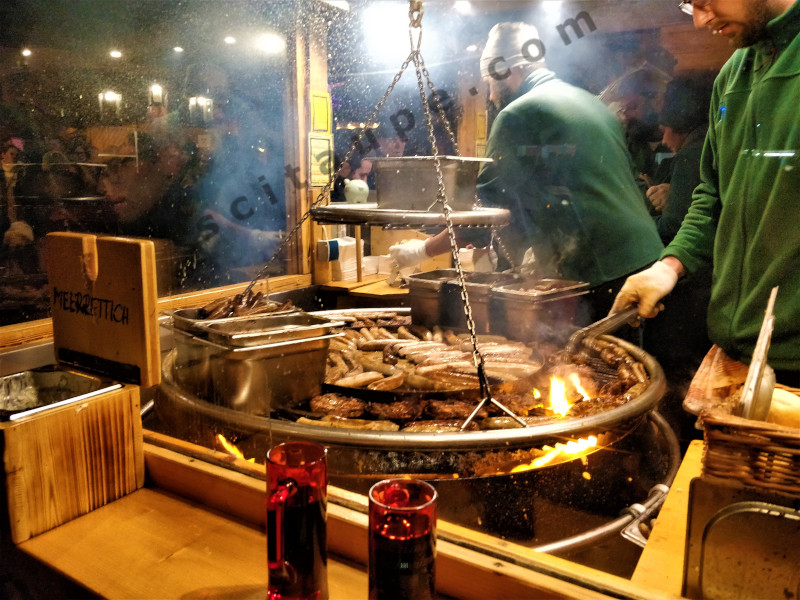 Traditionally prepared, char grilled Nuremberg sausages at Christkindlesmarkt